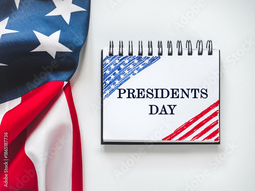 Happy Presidents' Day. American flag and congratulatory message. Greeting card layout. Close-up. Congratulations for family, loved ones, relatives, friends and colleagues