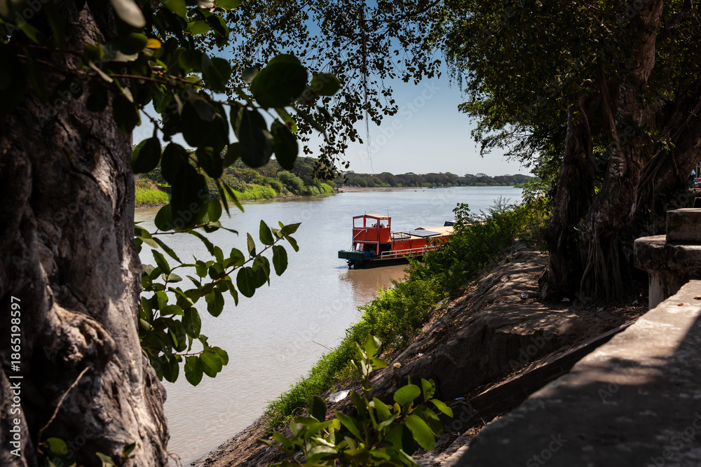 custom made wallpaper toronto digitalNon motorized ferry, called planchon, used by residents to cross the Sinu River from one bank to the other in the city of Monteria, Colombia.