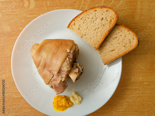 Cooked pork knuckle on plate top view