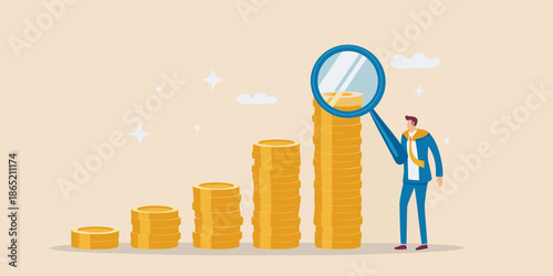 Analyzing financial growth a man examines stacked gold coins with a magnifying glass