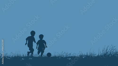 Silhouettes of two young children playing soccer on a grassy field against a vibrant blue background, embodying childhood fun and sport.