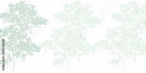 Silhouetted trees against a pale backdrop create a minimalist natural scene