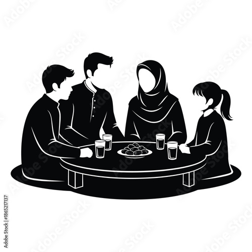 Muslim family sitting around table eating dates and drinking water for iftar