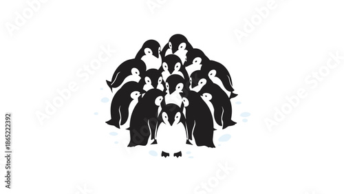 Group of emperor penguin chicks huddling together for warmth and protection, with one slightly larger chick in the foreground.