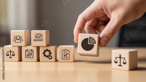 Business Resource Allocation Strategy. Hand selecting budget block from planning elements, prioritizing financial resources for annual execution.
