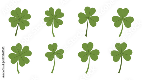 A collection of green four leaf clovers arranged on a white background
