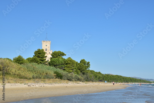 The sandy beach of Pineto (Italy) With the famous tower castle called Torre di Celano. 