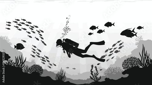 Silhouette of a scuba diver swimming amongst a school of fish