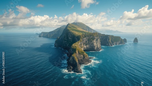 Majestic rock structure amidst the blue waters of the Tasman Sea, highlighting natural geological features