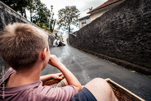 Valokuva Scenic view of a child enjoying a thrilling toboggan ride downhill on a wicker s