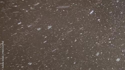 Heavy winter snowfall in city park slow motion