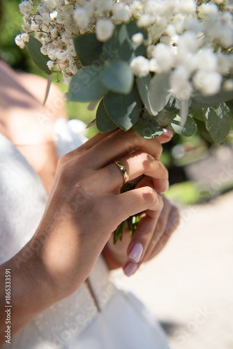The hand of a bride with an engagement ring. Weeding day.