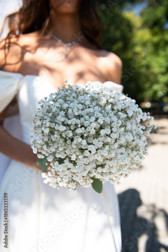 The bride is holding a bridal bouquet. Wedding bouquet.