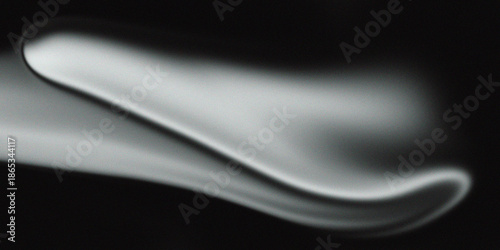 Abstract smooth white form on black grainy background