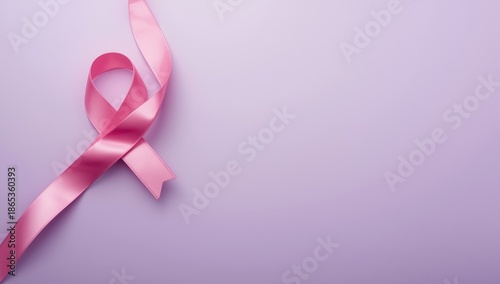 Pink ribbon on a purple bac...