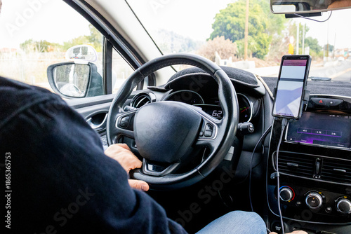Driver Hands on Steering Wheel Inside Modern Car Interior