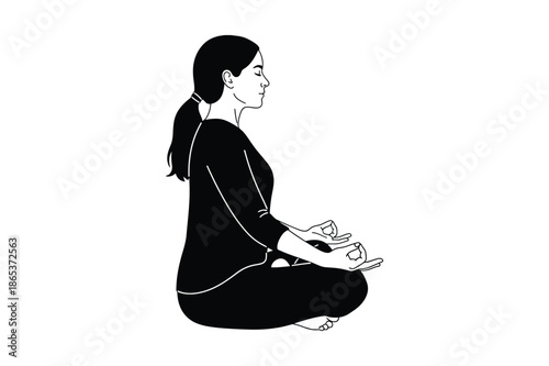 Woman practicing yoga meditation in lotus position silhouette