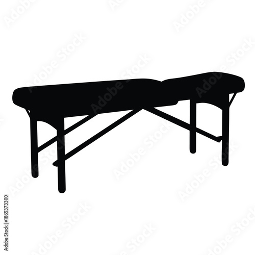 Black silhouette of a portable massage table on a white background