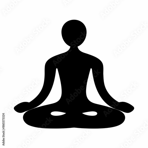 Silhouette of a person in lotus pose meditating and finding inner peace
