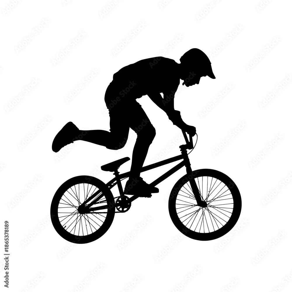 Fototapeta premium Silhouette of a bmx rider performing a trick isolated on white background