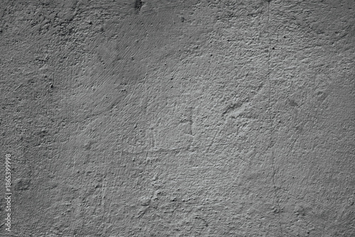 Canvas Print Rough gray concrete wall surface with subtle shadows and texture, close up