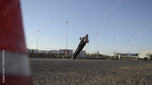 Cinematic Motorcycle Stunt Rider Against Sunset Sky