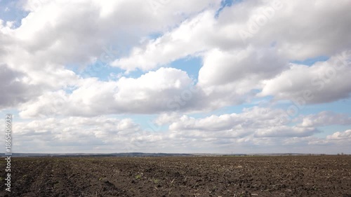 Agricultural landscape arable field. business agriculture concept. soil walk sky on brown black arable a land. preparation for sowing crops in agriculture landscape motion steadicam. farming field