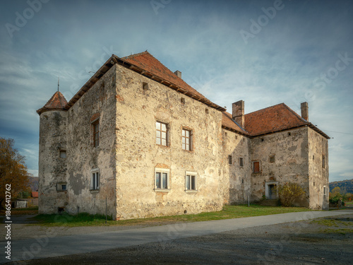 Wallpaper Mural view to facade of old palace with red roof in cloudy day with soft sun light on the walls with copy space Torontodigital.ca