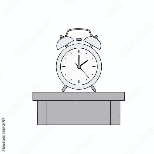 A classic alarm clock, silver, on a gray platform, set against a white background