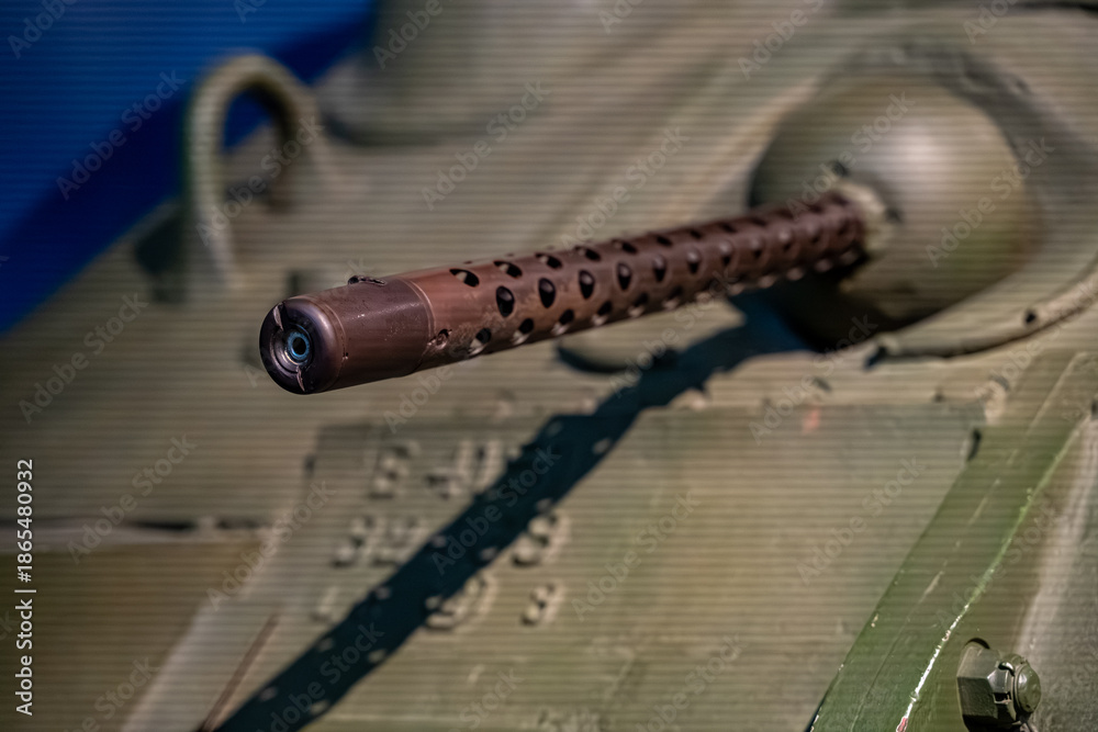 © Erman Gunes - Close up of tank machine gun barrel detail.
