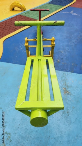 Green Playground Equipment on Colored Floor.