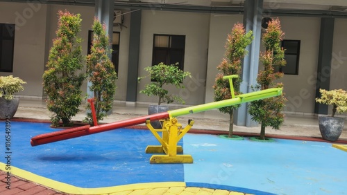 Colorful Playground Equipment in Schoolyard Setting.