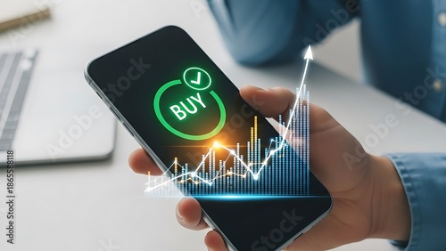 Mobile phone displaying buy signal on stock market graph, signifying online trading and investment opportunities