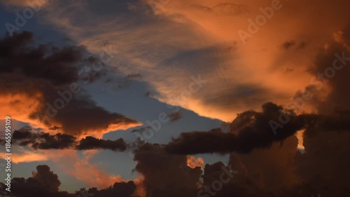 Timelapses. Beautiful 4K timelapse of a dramatic sunset with glowing orange and red clouds, perfect for cinematic projects and nature footage.