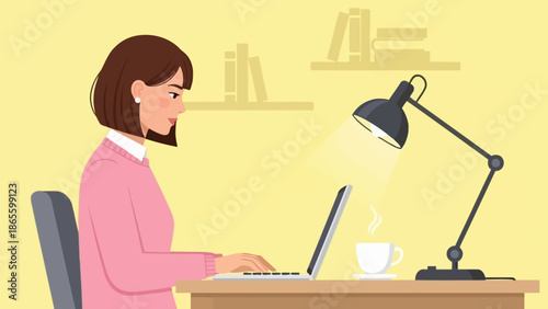 Woman Working on Laptop at Desk.