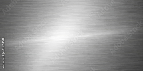 Polished silver brushed metal texture featuring a shiny stainless steel plate with a grey industrial aluminum surface and metallic reflection pattern for an elegant material backdrop