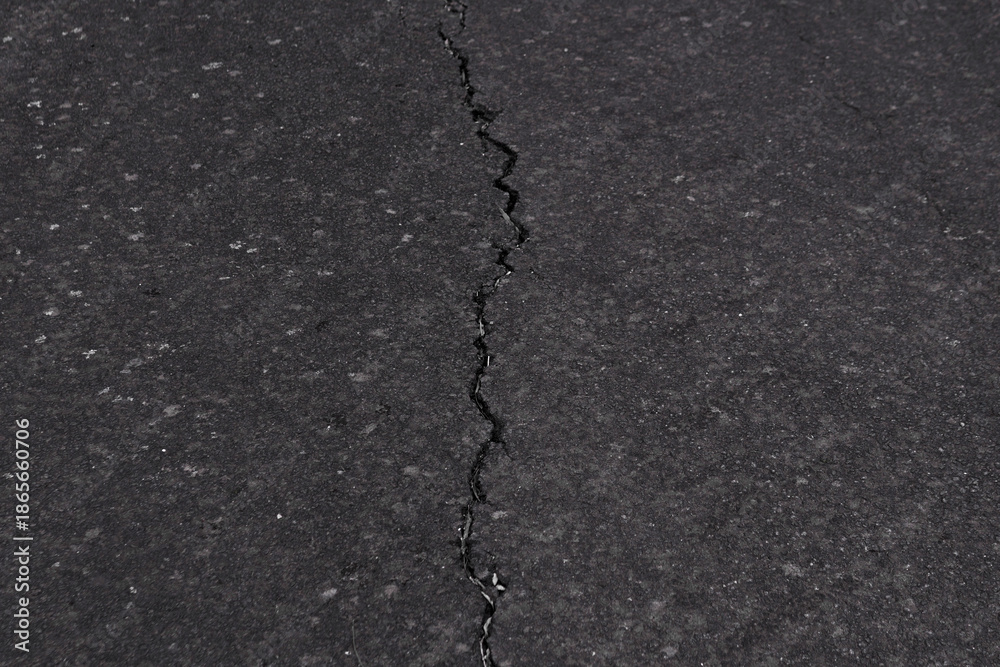Obraz premium Cracked or Damaged road texture background 