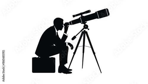 A businessman in silhouette looks through a telescope on a tripod outdoors