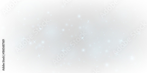 Blue glowing dust sparkles with glitter and shimmer across soft bokeh. Twinkle, sparks, luminous highlights, and flare form magical holiday light. Christmas png vector illustration.