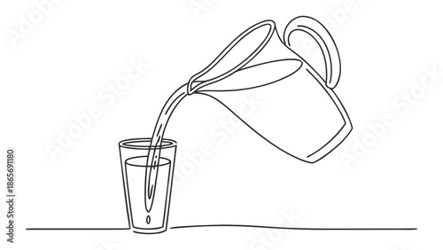 Clean water being poured from a pitcher into a clear glass, symbolizing refreshment and simplicity.