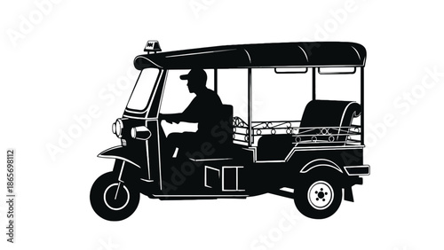 A silhouette of a driver operating a tuk-tuk vehicle.