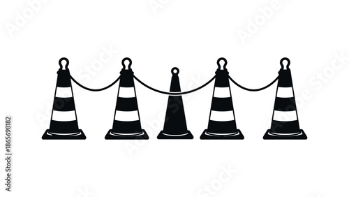 A row of black and white stanchions with a rope barrier.