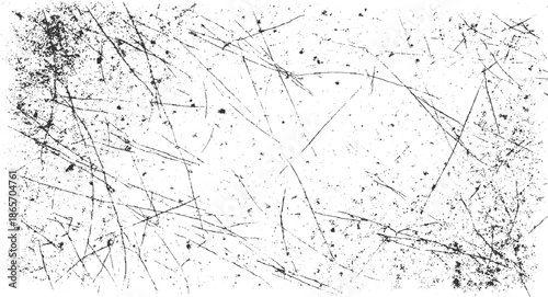 Black scratches and speckles on a white background abstract texture