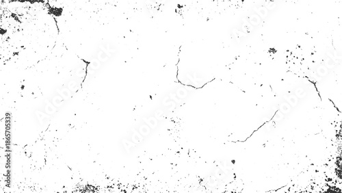 White surface with black cracks and speckles grunge texture
