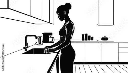 A woman in silhouette washing dishes in a modern kitchen sink