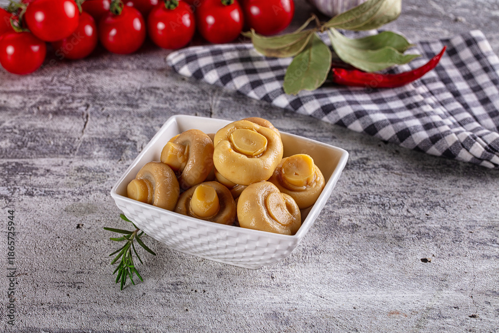 Fototapeta premium Marinated pickled champignon in the bowl