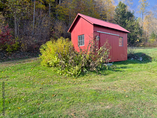 Wooden Farm Building In A Meadow