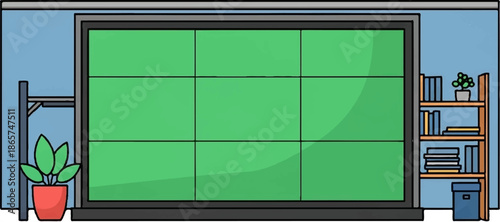 A classroom or office space with a large green screen and bookshelf