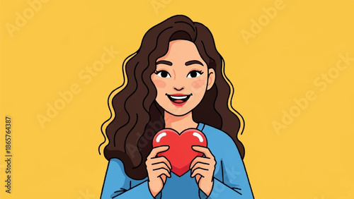 Cheerful woman with wavy brown hair and a blue shirt holds a red heart against a yellow background