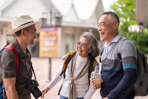 Happy senior tourists talking together, enjoy retirement with friendship and active aging, positive travel experience, elder wellness, senior travel tour, retirement life insurance and healthy living